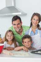 Family home baking together in the kitchen