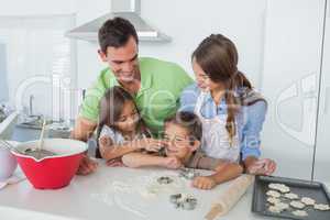 Sister putting flour over the nose of her brother