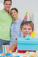 Little boy holding his birthday gift