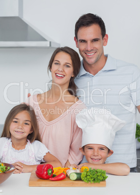 Beautiful family standing in the kitchen