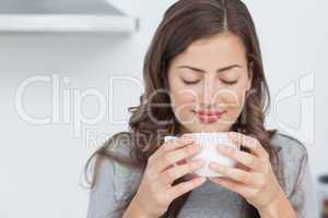 Woman waking with the smells of coffee