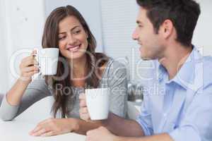 Beautiful couple drinking a cup of coffee