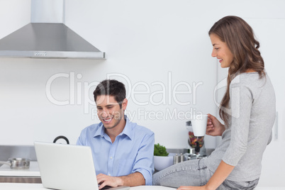 Man using his laptop in the kitchen