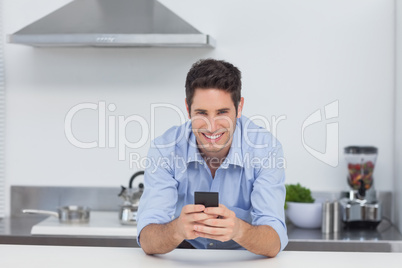 Man typing on his smartphone