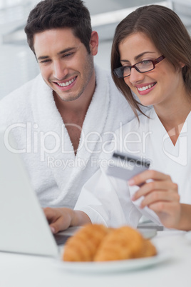 Beautiful couple purchasing online