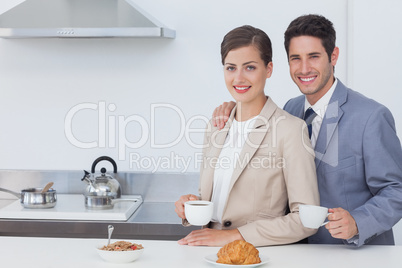 Couple of business people having breakfast