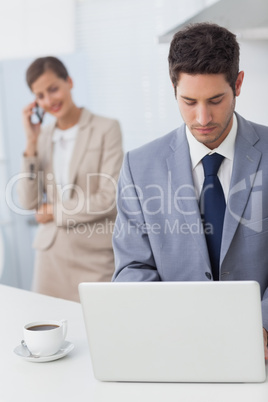 Businessman using a laptop before going to work