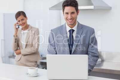 Businessman using a laptop in the morning