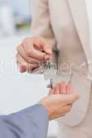 Estate agent giving house key