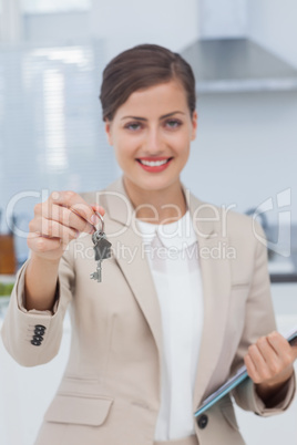 Real estate agent offering house key