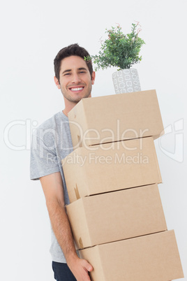 Man carrying boxes because he is moving