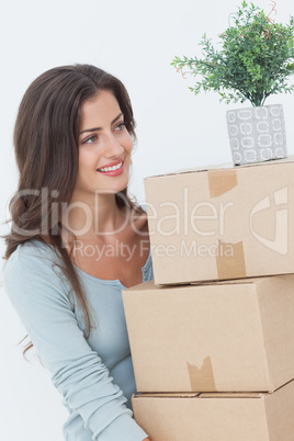 Woman holding boxes because she is moving