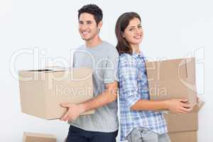 Wife and husband carrying boxes