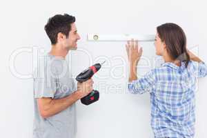 Man and his wife doing diy together