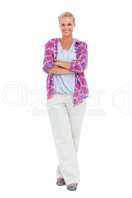 Cheerful woman standing with arms crossed looking at camera Cheerful woman standing with arms crossed looking at camera