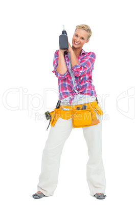 Blonde standing with a power drill
