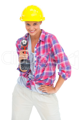 Smiling handy woman with a power drill