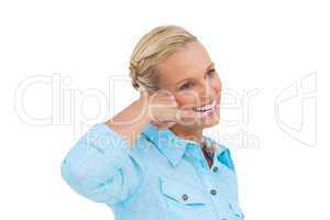 Attractive blonde doing a symbol of phone with her hand and look