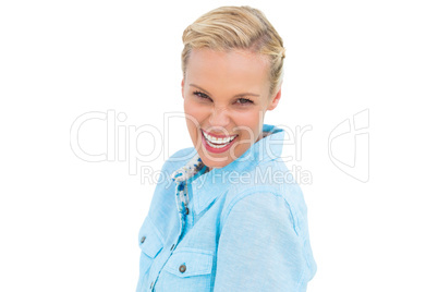 Blonde woman laughing at camera