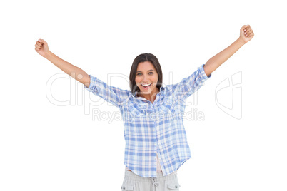 Young woman standing and raising arms