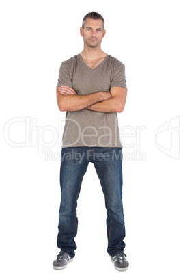 Focused man with arms crossed