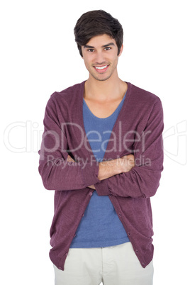 Smiling young man with arms crossed