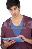 Serious man using tablet pc