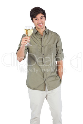 Young man holding wine glass