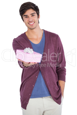 Young man holding a gift