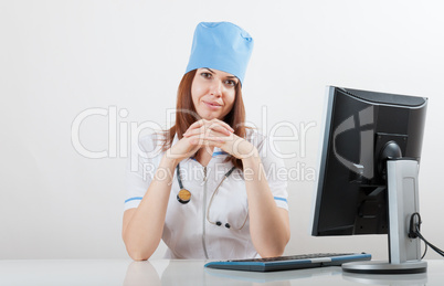 doctor at a computer