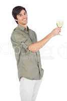 Happy young man with wine glass of white wine
