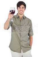 Happy man showing red wine glass