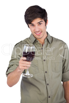 Smiling man holding red wine glass