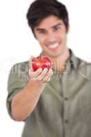 Man holding apple on his hand