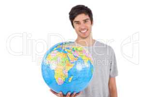 Man presenting a globe