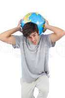 Man holding a globe on his back