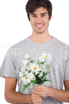 Young man holding flower bouquet