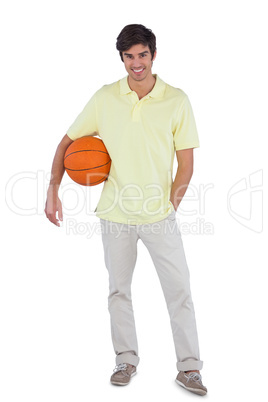 Young man holding basket ball