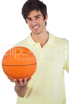 Portrait of a smiling man holding basket ball