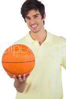 Portrait of a smiling man holding basket ball