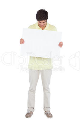 Young man looking at empty panel