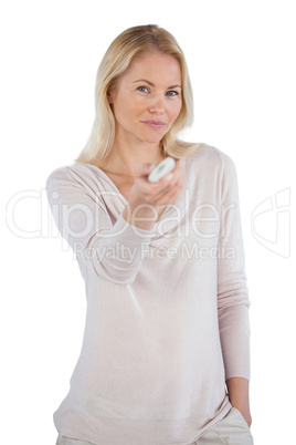 Smiling woman using remote control