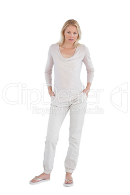 Concentrating woman with hands in pockets
