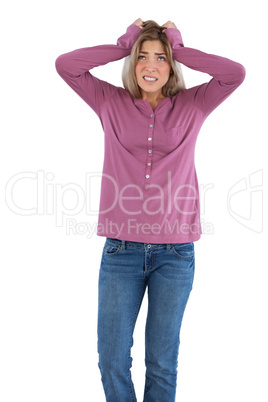 Anxious woman with hands on head