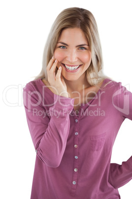 Smiling woman with hand on chin