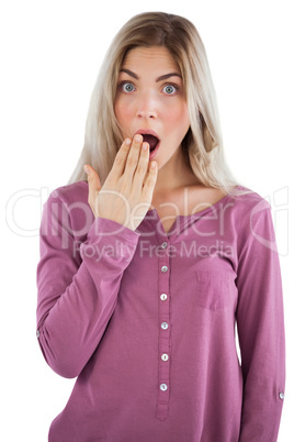Surprised woman with hand on mouth
