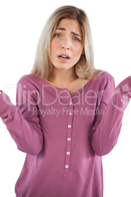 Confused young woman looking at camera