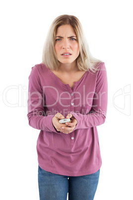 Doubtful woman with remote control