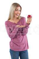 Young woman presenting an apple