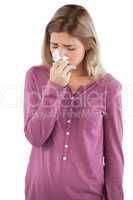 Woman blowing her nose